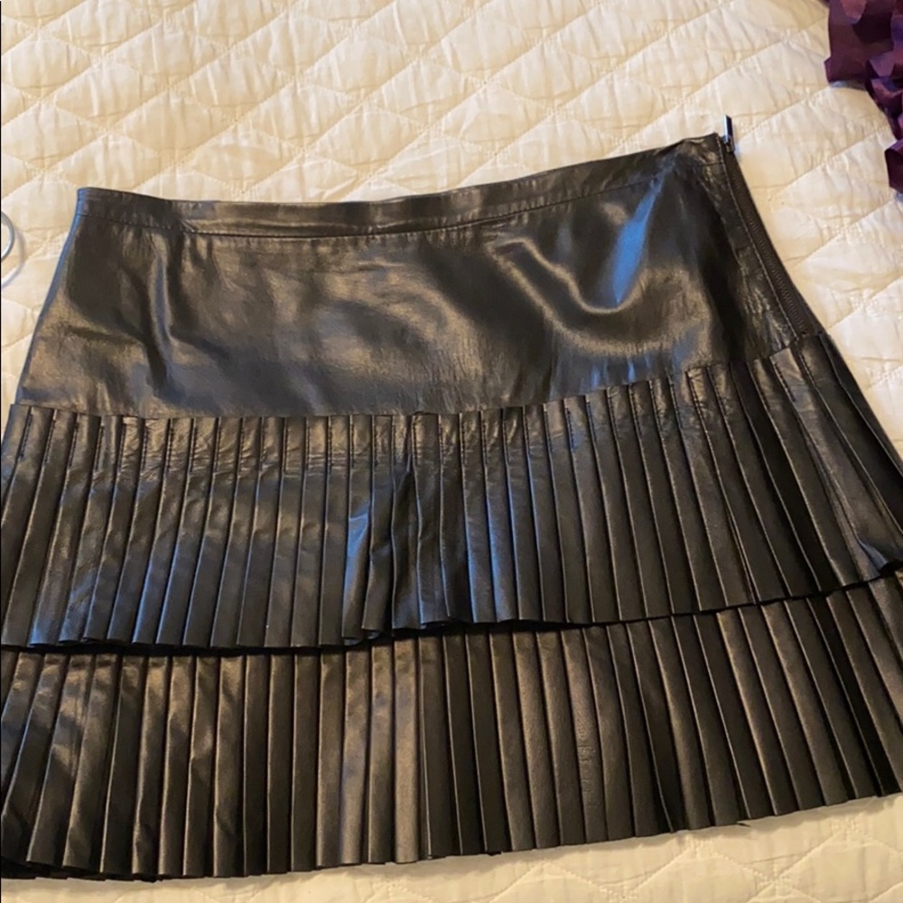 Black pleated lamb leather BCBGMAXAZRIA skirt.